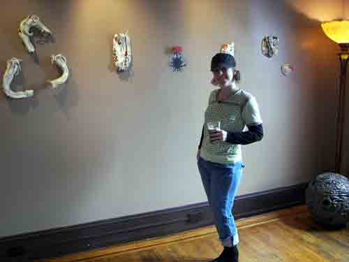Artist Brooke Hine with her work upstairs at the North Star Bar in Brewerytown.