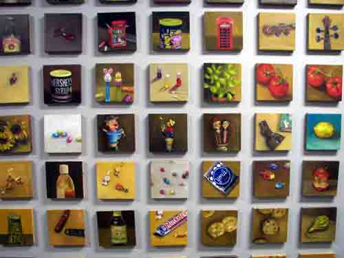 Heres a cool art idea you can steal - just paint hundreds of small paintings and mount them on a wall as a group; it should only take you a few years to complete.  Paintings by Ann Elizabeth Schlagel @ The Banana Factory.